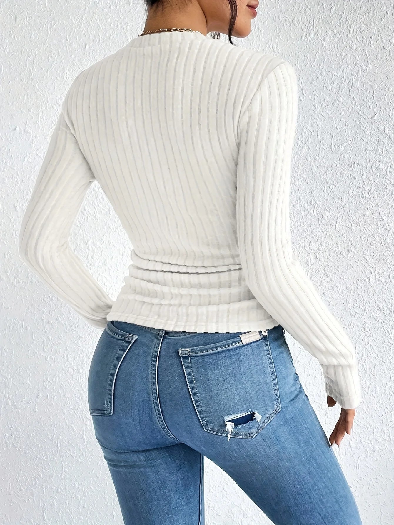White long-sleeved turtleneck blouse