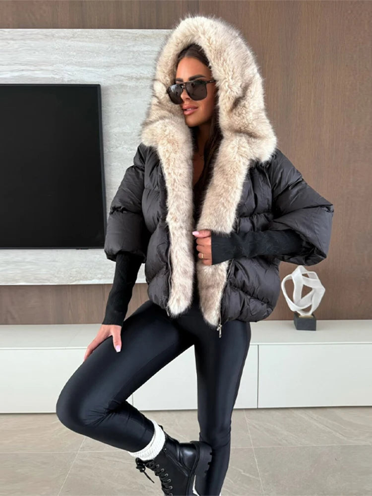 Women's hooded coat with faux fur details and knit cuffs